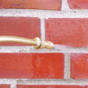 Close Up of Water Repellent Being Sprayed on Bricks