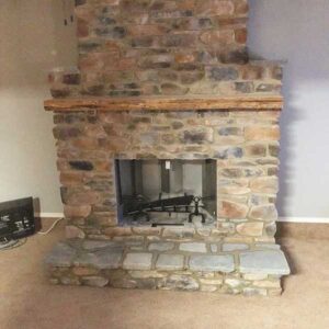 Prefab Chimney Completed with stone surround, hearth and chimney.